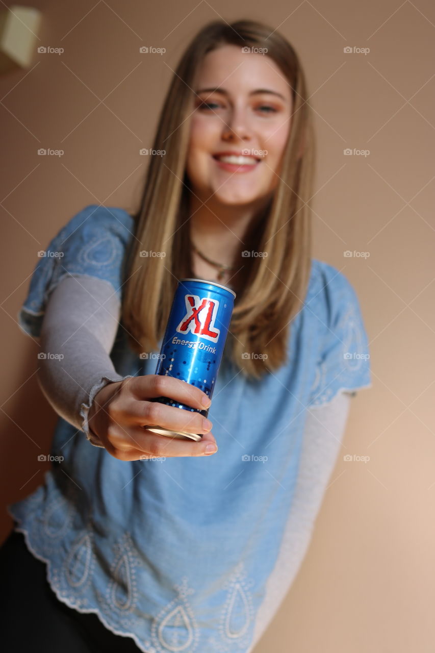 Daughter holding XL Energy Drink 