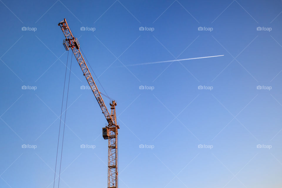 construction crane on blue sky background