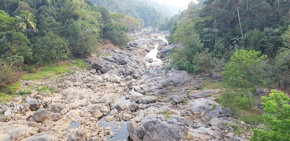 River is full of rocks.