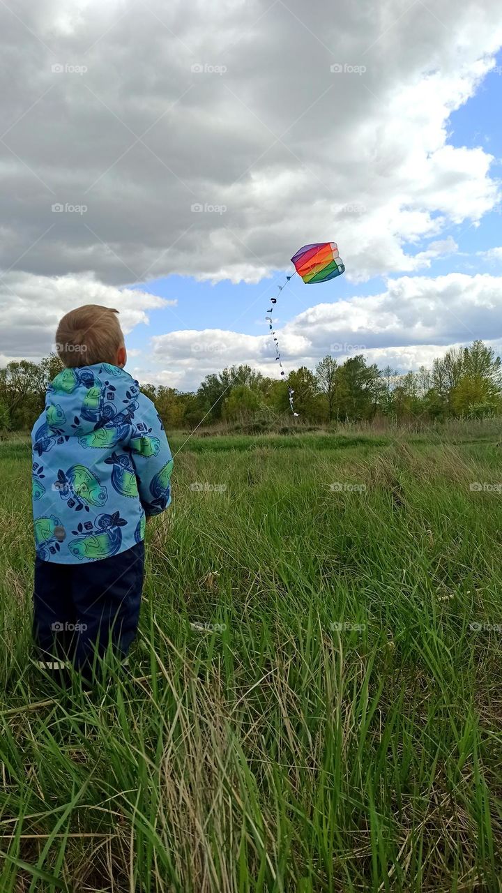 a boy with a kite