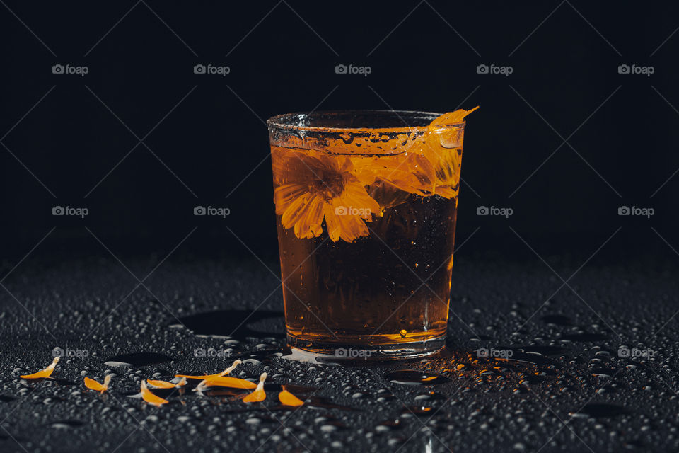 herbal tea in glass jar . yellow color concept