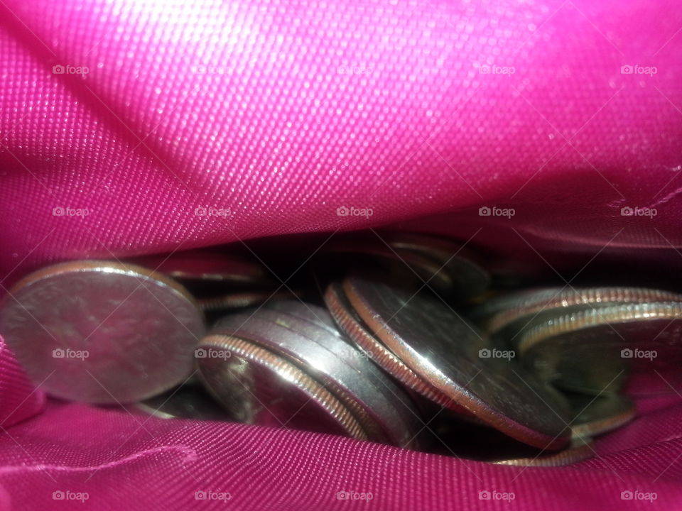 spare change in pink purse