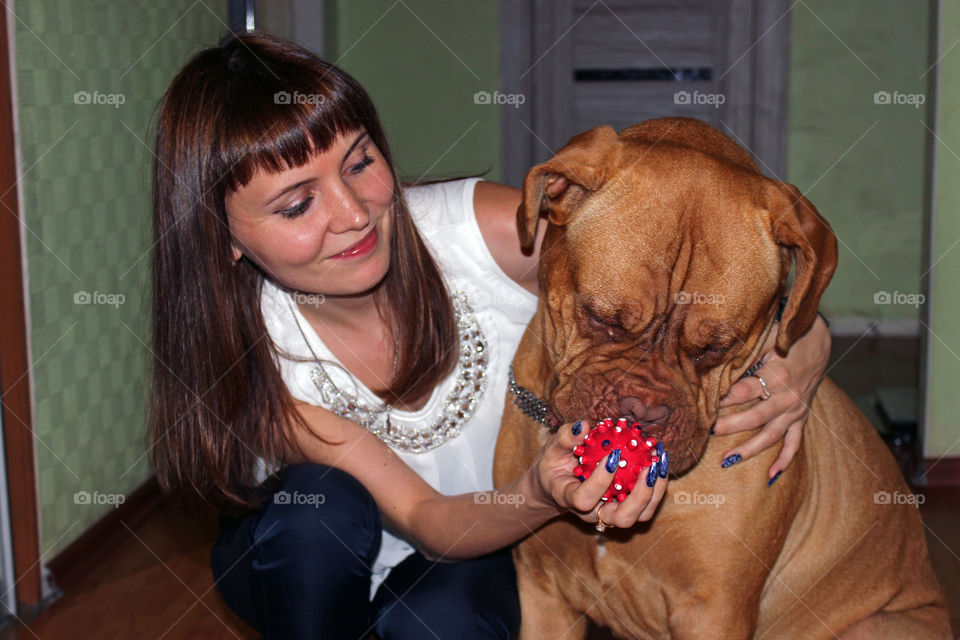 girl playing with a big dog