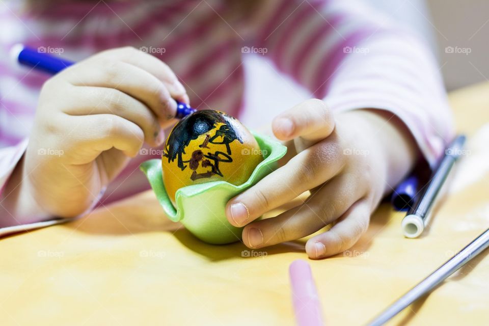 kids painting easter eggs