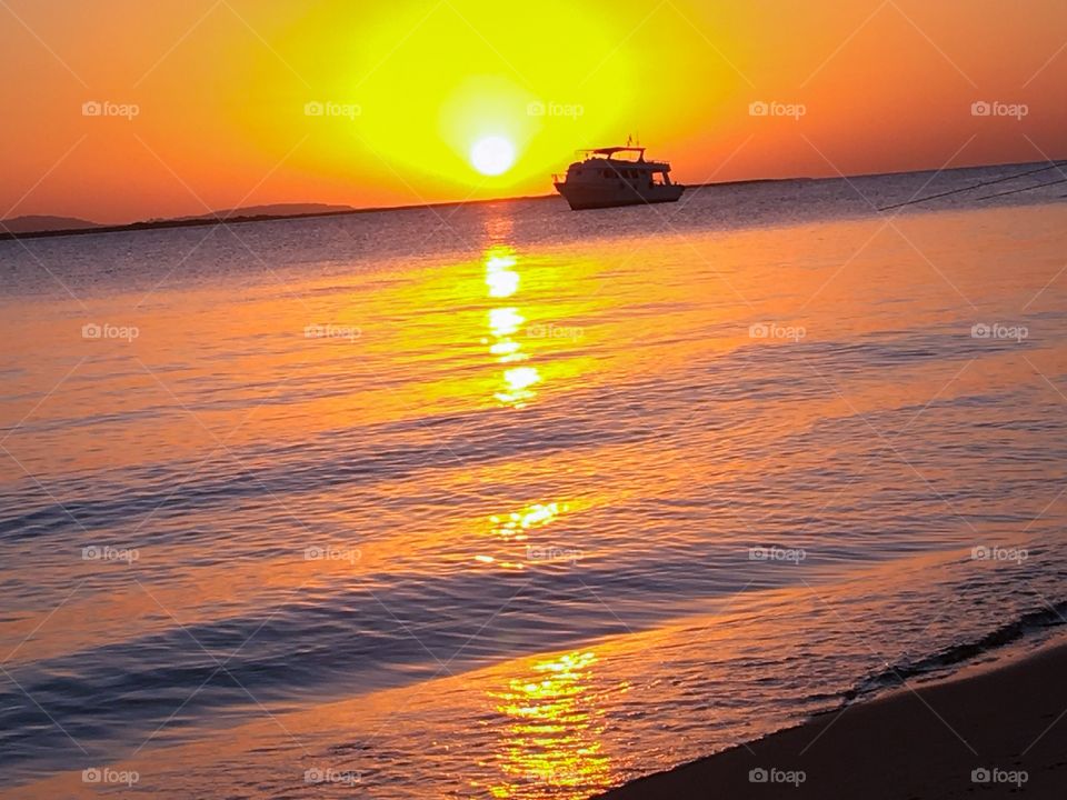 Silhouette of boat at sea