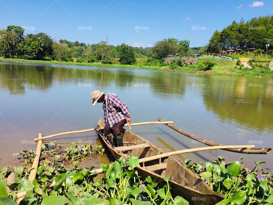 Old man on an old boat 