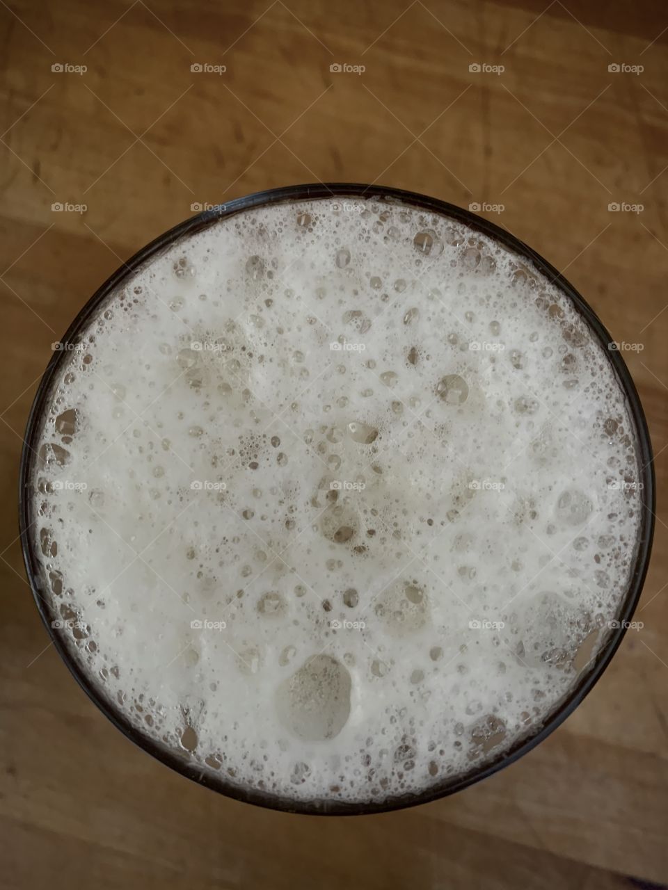 Overhead view of glass of beer