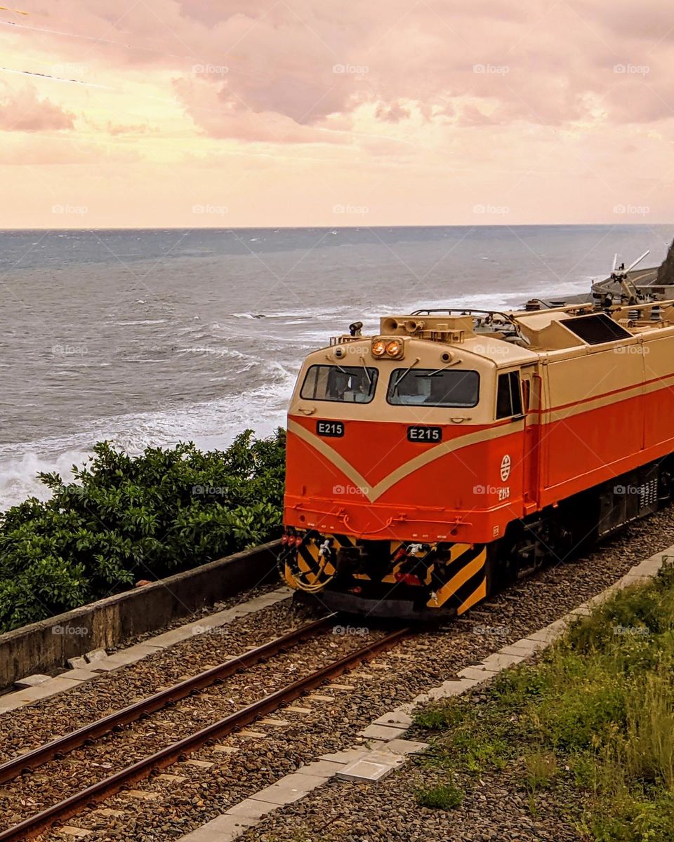 Train runs by the coastal