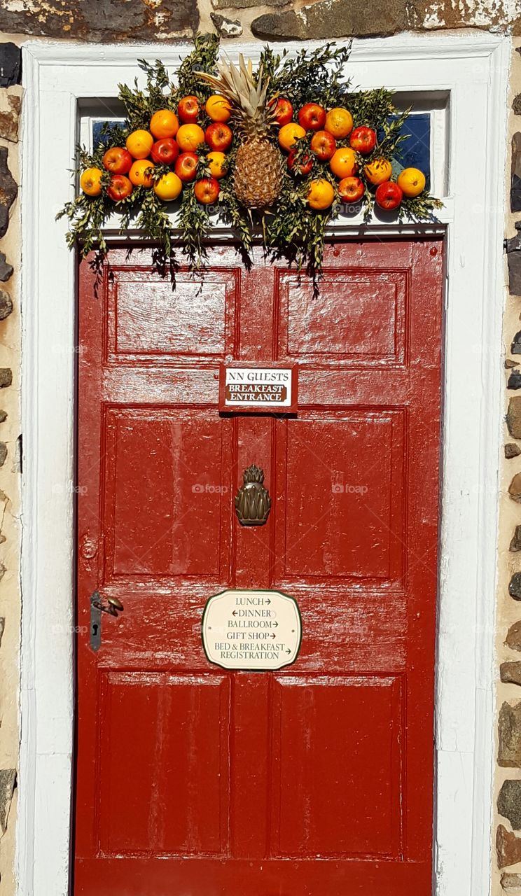 The door to the Inn decorated for Christmas