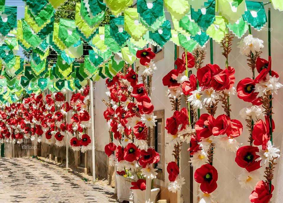 Red & green street decorations in Tomar, Portugal