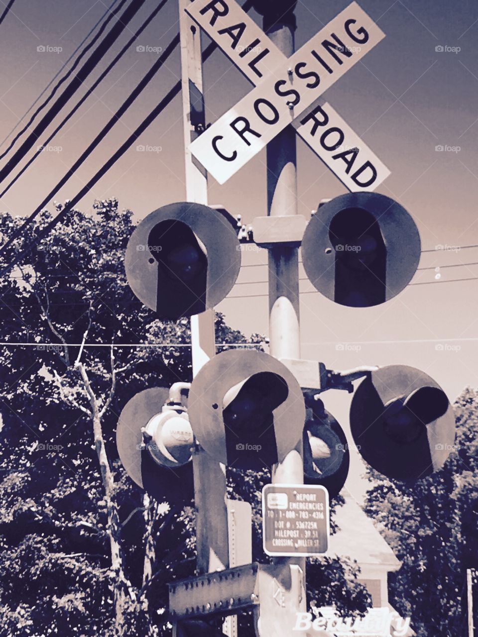Railroad crossing sign in sepia, close up!