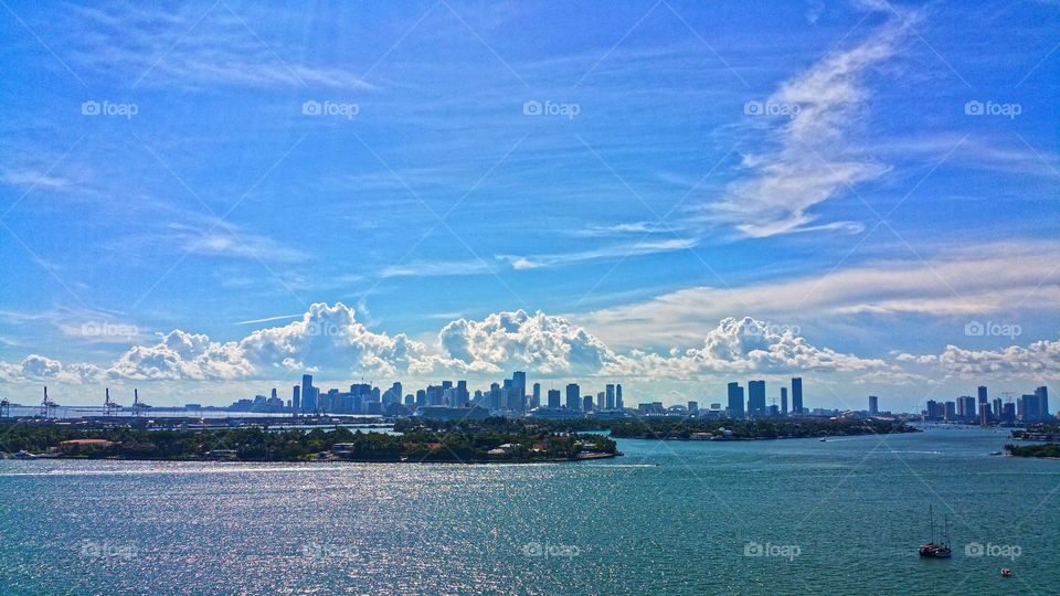 Suns rays shinning down on city of Miami
