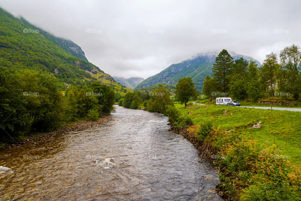 Camper trailer in mountains.