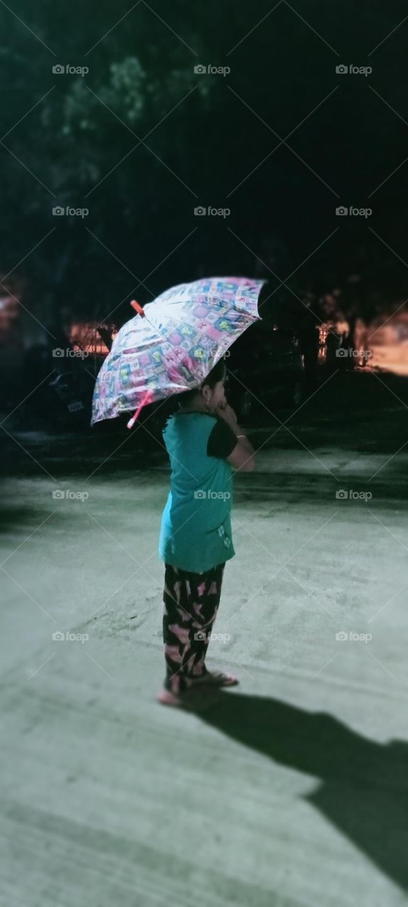 A girl waiting for rain 🌧️☔ Girl is standing on road taking umbrella and she waiting rain because this time to starts rain.