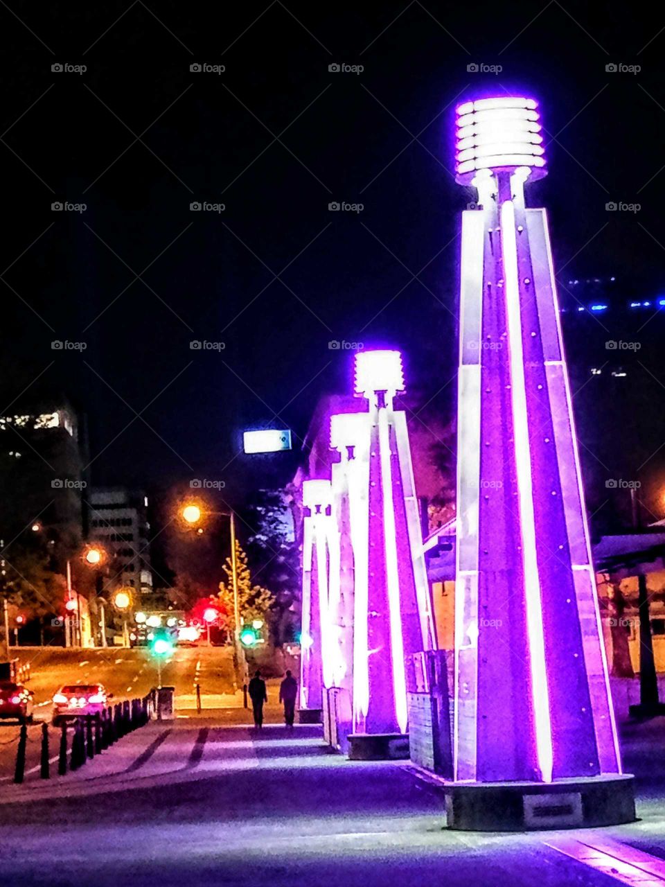 light towers by the waterfront at night