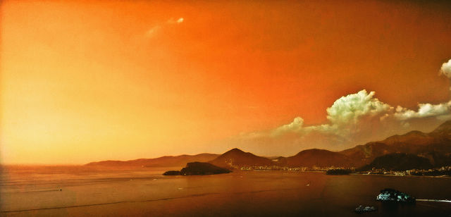 amazing sunset, sea, mountains, island and city