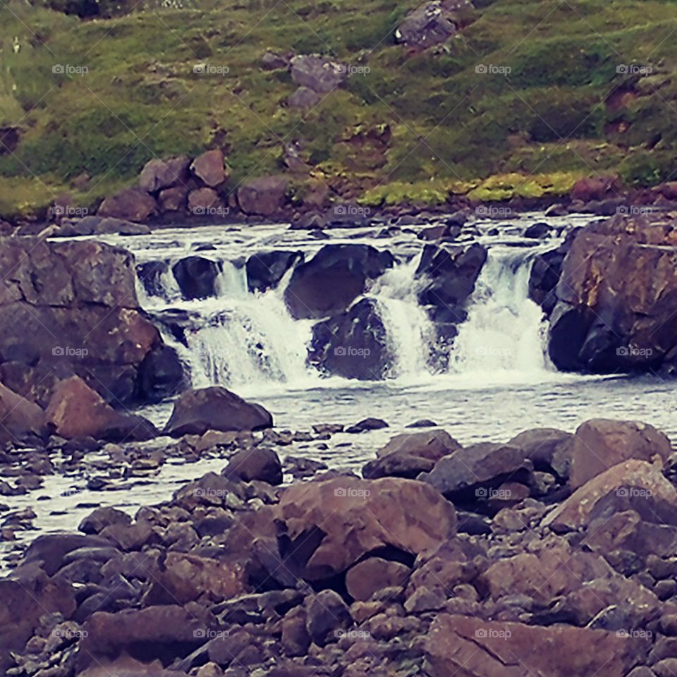 Icelandic waterfall. Flowing waters.