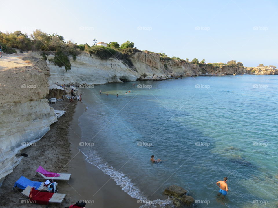 Sandy beach and steep rocky shore