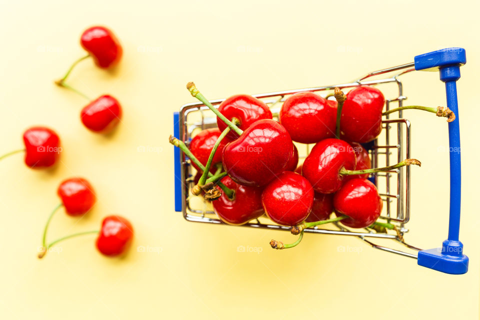 Red cherry in grocery cart