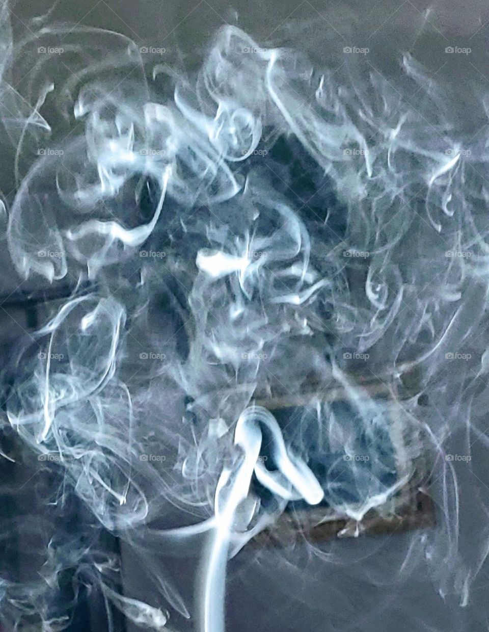 Skull face💀in smoke ring. B&W or monochromatic pic of smoke ring!