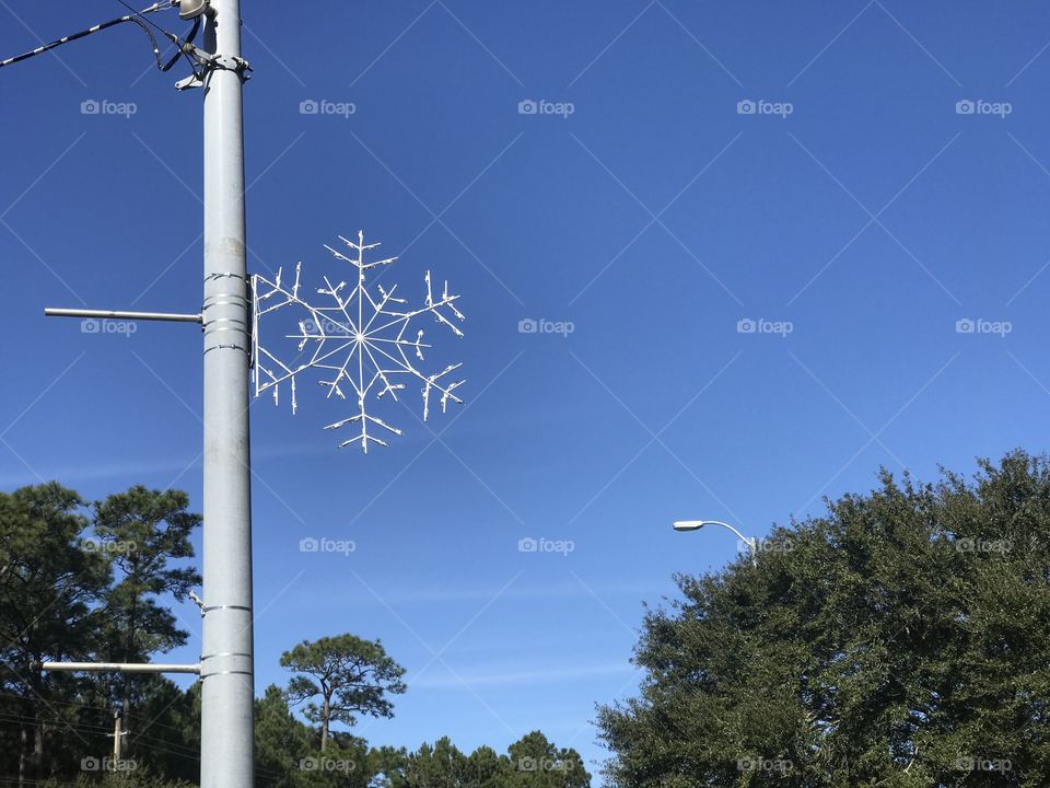 Snow flake decoration on a utility pole 
