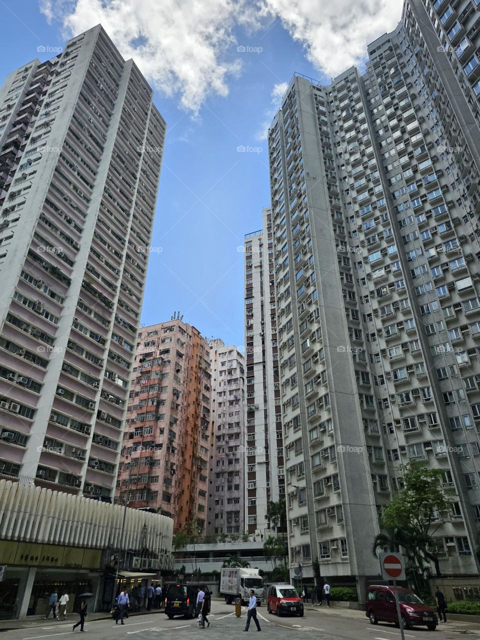 Summer in the city, street hovered by buildings