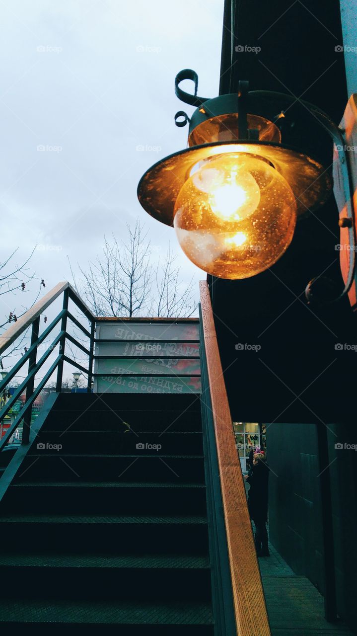 glowing lantern at the entrance to the stairs