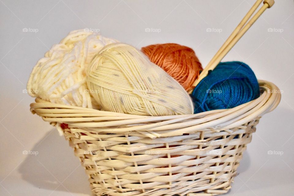 Colorful ball of wool in the basket