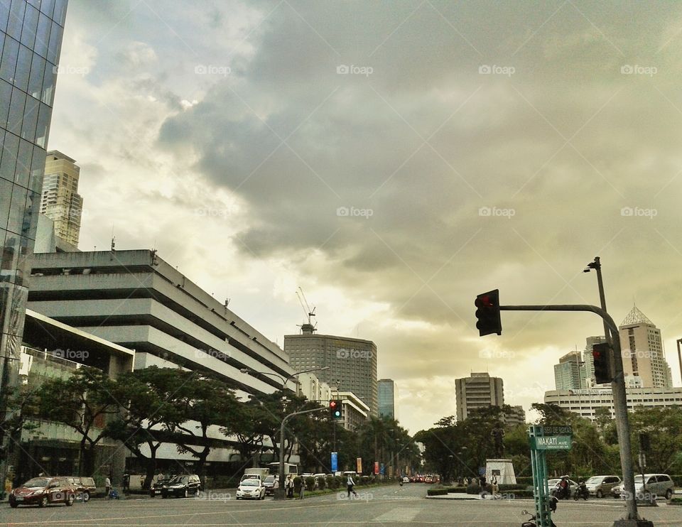 before it rains. makati ave and paseo de roxas intersection