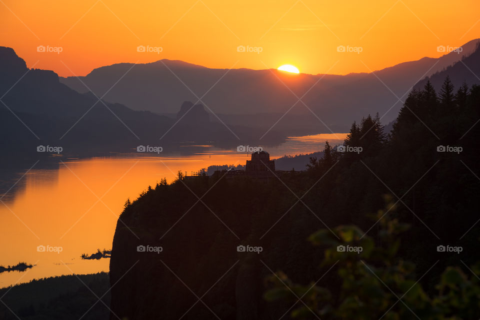 Sun rises over the Columbia River Gorge in Oregon 