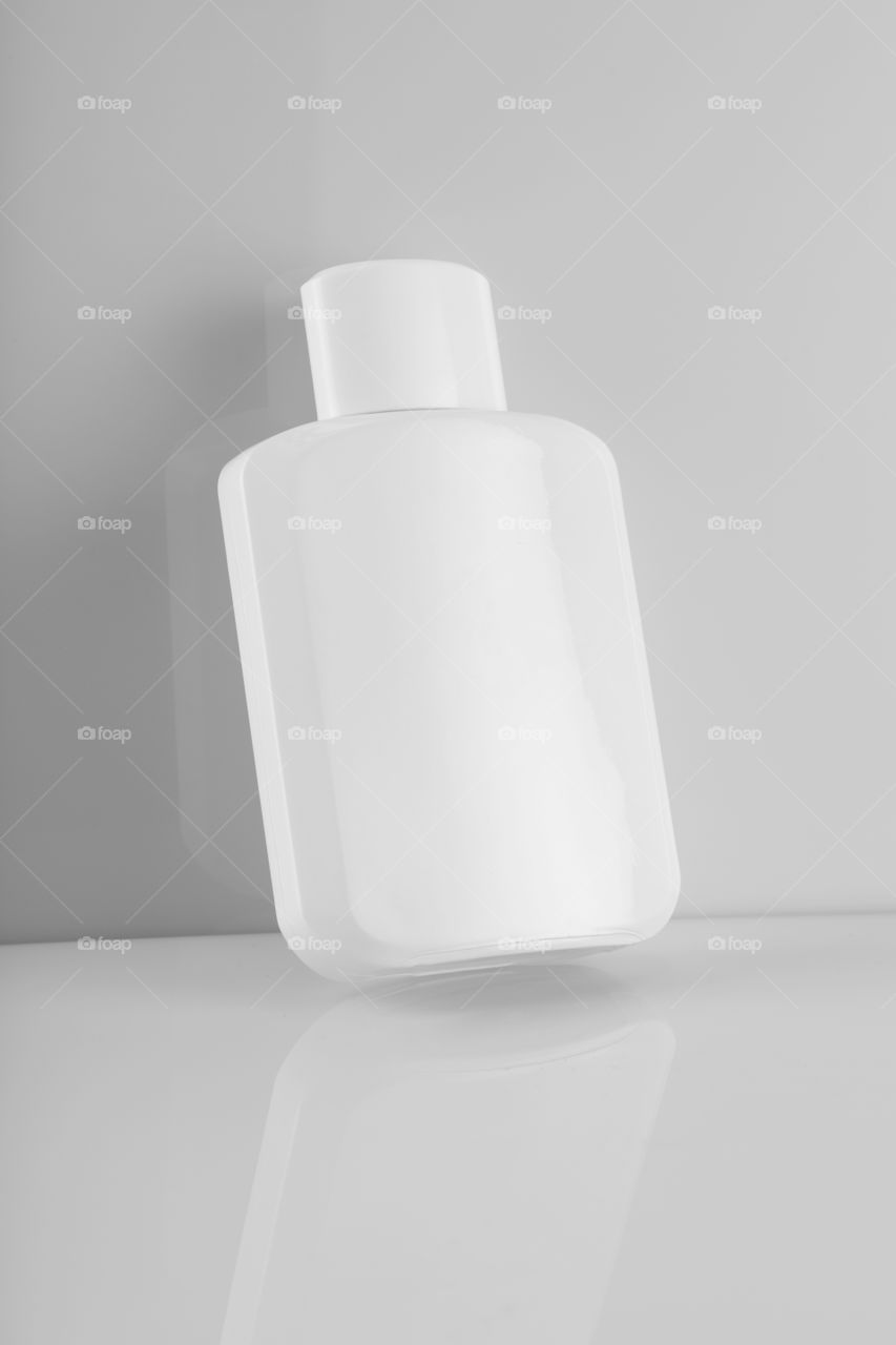 Blank White perfume or lotion bottle in white background