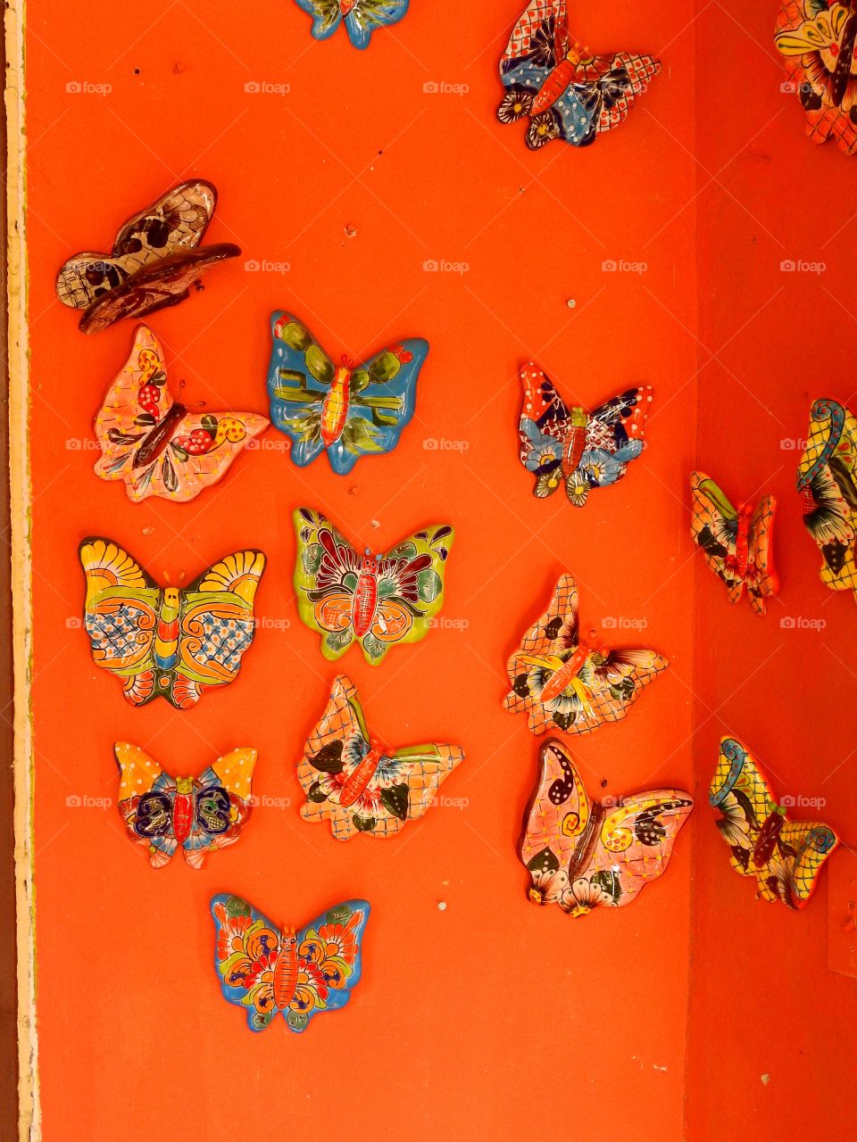 Butterflies on orange wall