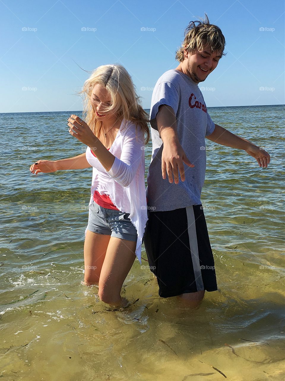 Happy couple enjoying in the lake