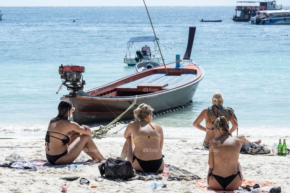 Tourist sunbath on the beautiful beach