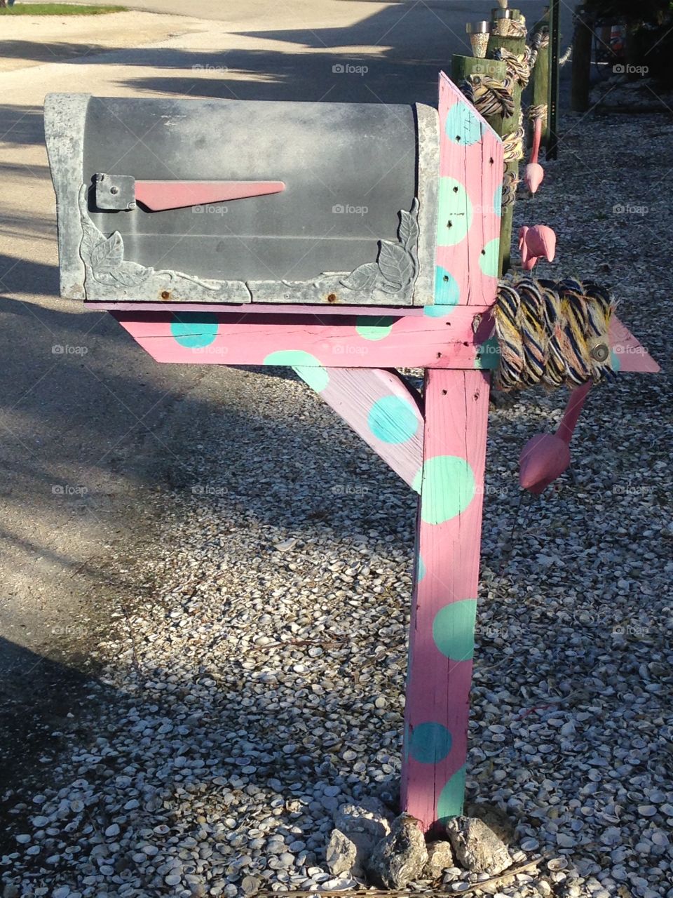 Pink mailbox post with polka dots