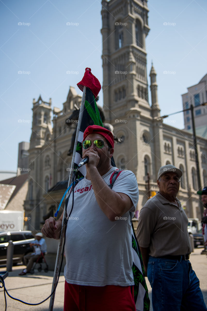 Adam Eisenger talks to a crowd before the "Jay Walk" demonstration at the DNC in Philadelphia. 