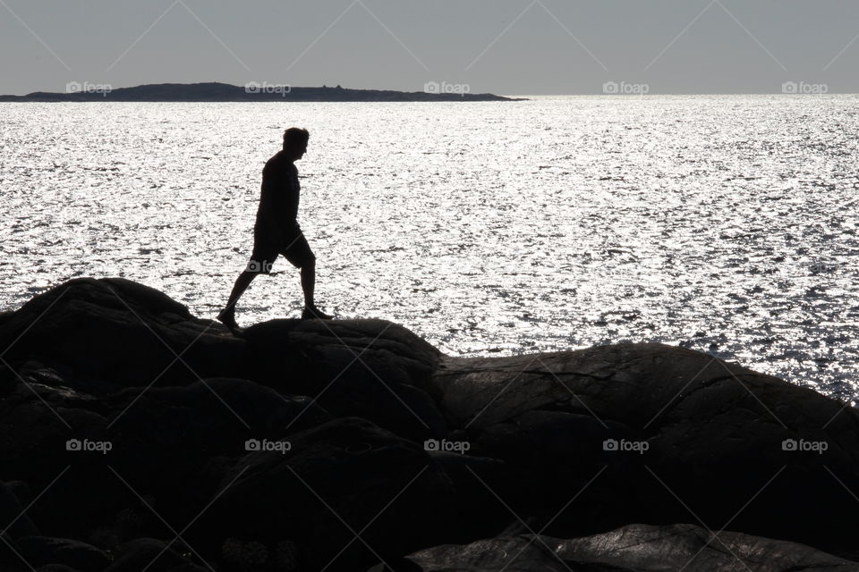 Man walking by the sea