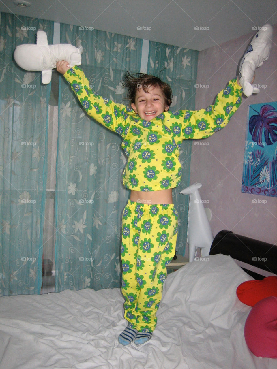 Boy Jumping in Bed