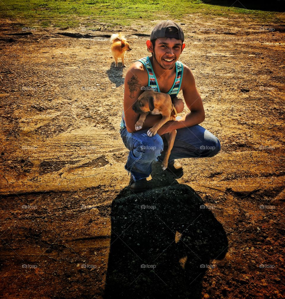 Smiling man holding his pet