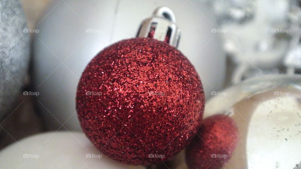 A red glitter Christmas ball