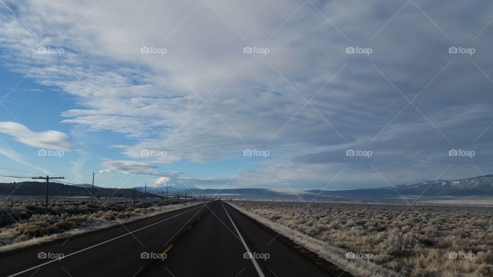 open roads with dramatic skies