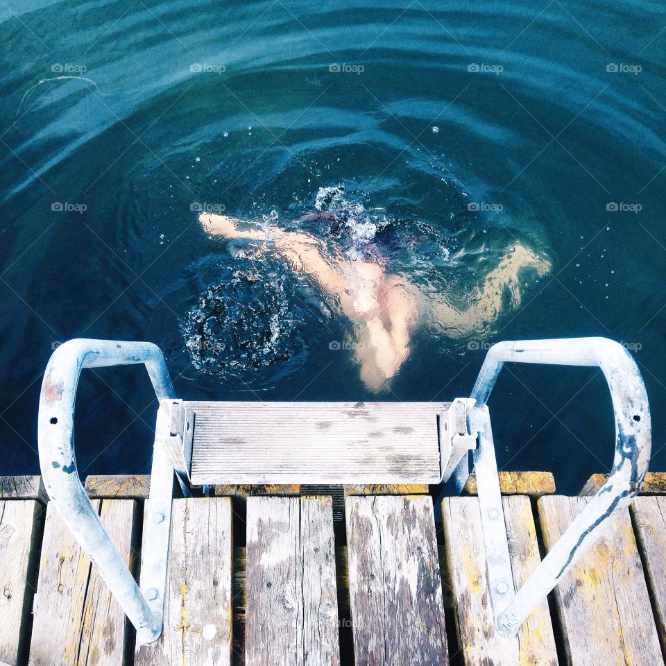 Diving. Woman diving into water 