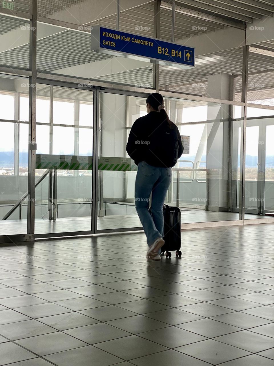 Back view of woman in window 