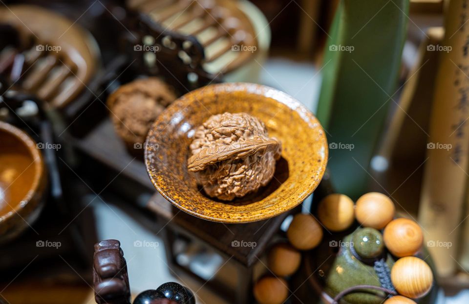 A nut is placed in a tiny bowl