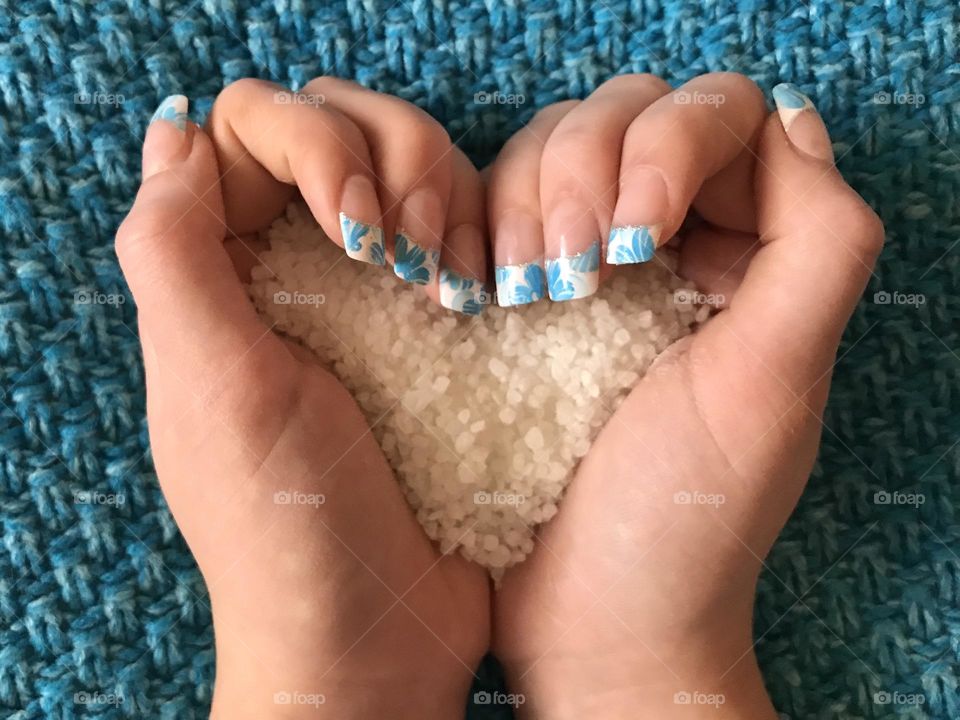 Manicure with blue and white French tips and blue background. 