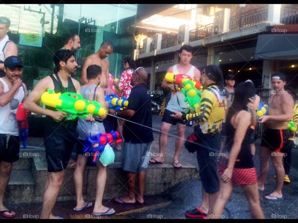 Songkran. Thailand New Year National holiday. Water gun fights. People Celebrating.