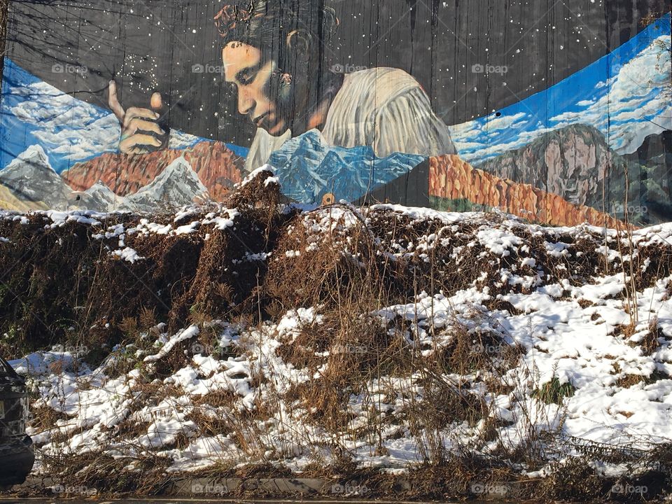 Native American mural and snowy landscape