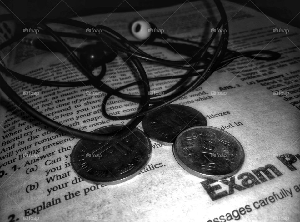 indian currency with headphones