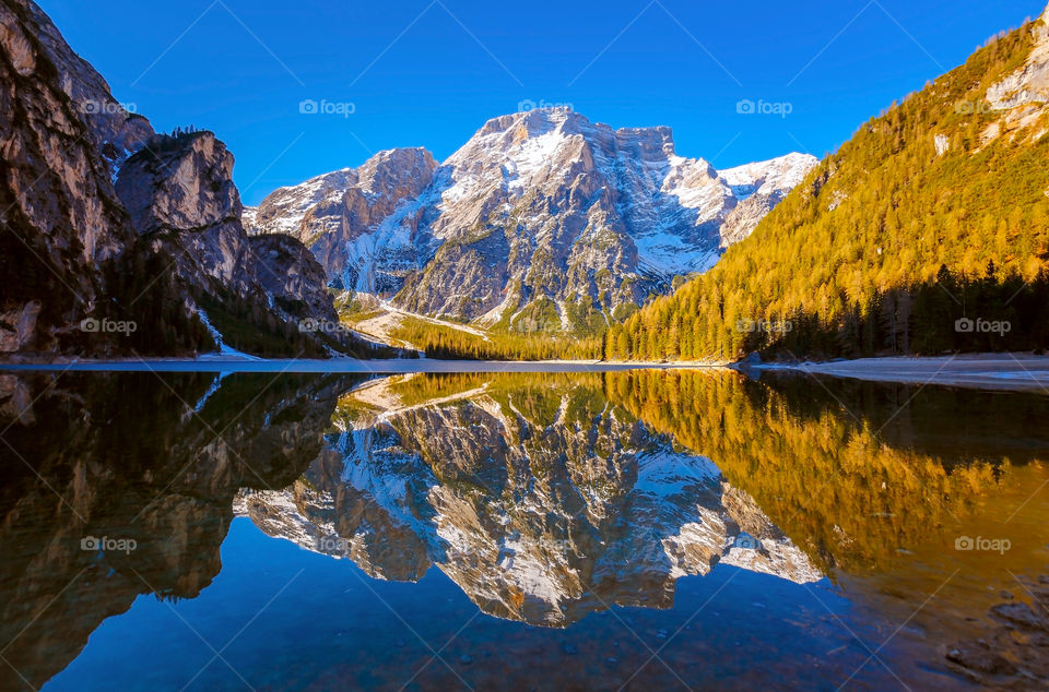 Reflection on mountains at lake Braies, Dolomites