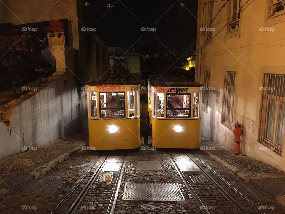 Tony Bulhoes. A night view of Lisbon traditional funicular 